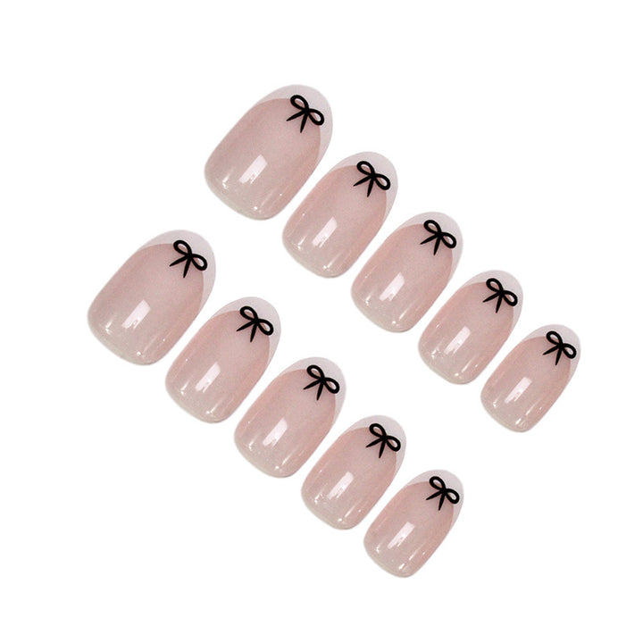 Acrylic nail set with playful bow design Stornfield