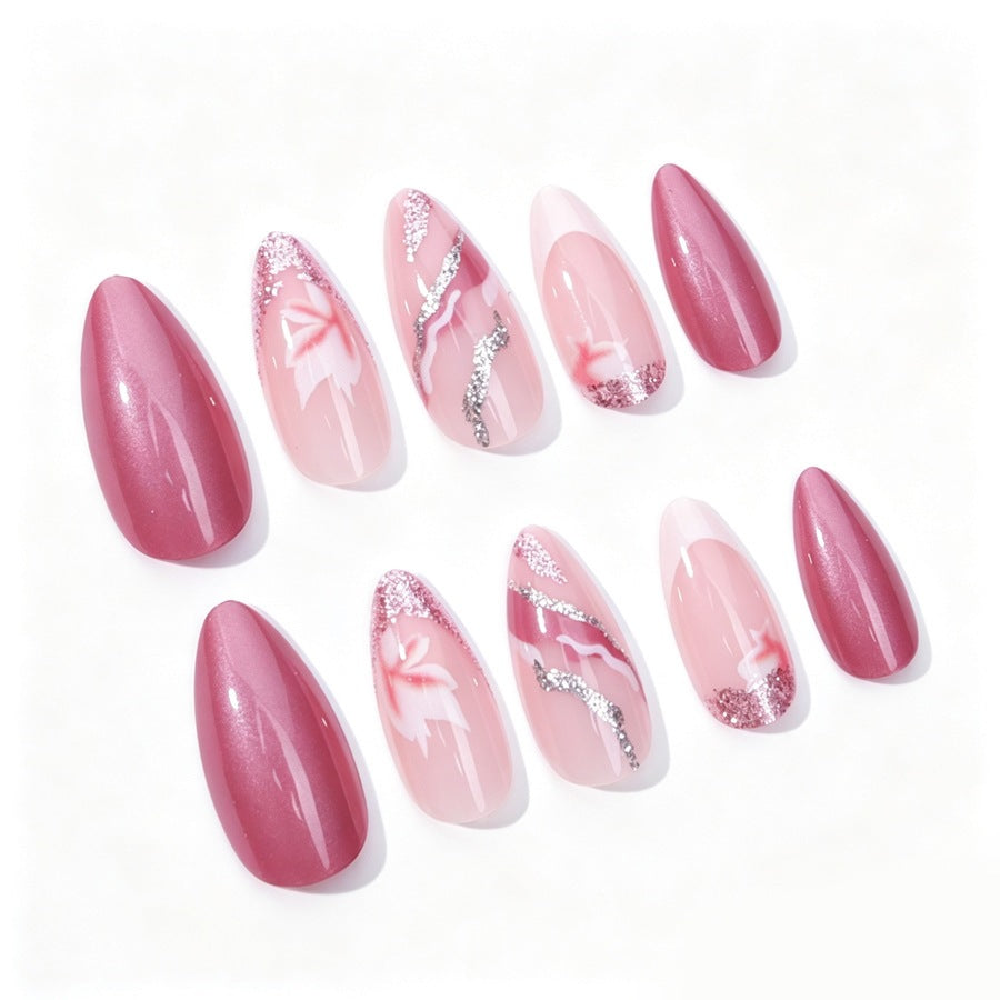 Acrylic nail set with floral patterns and glitter elements Stornfield