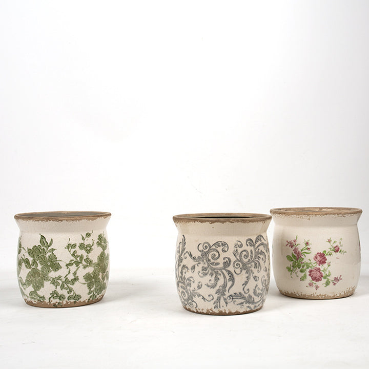 Decorative ceramic plant container with artistic design Stornfield