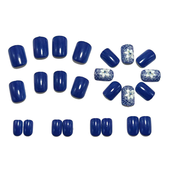 Artificial nails in elegant glitter design with floral embellishments Stornfield