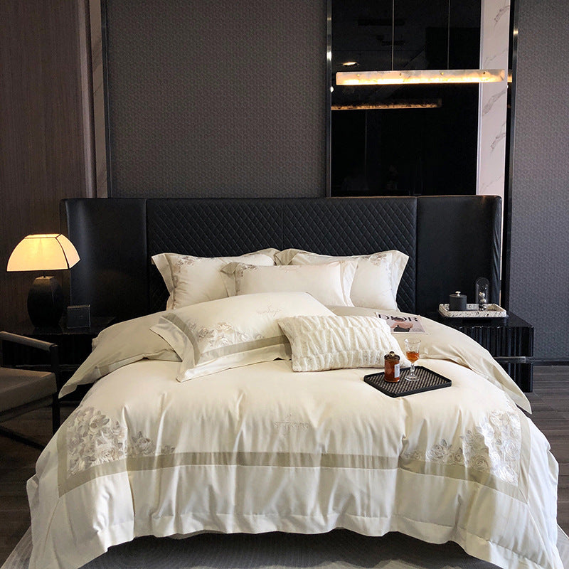 Hotel-style bedding set made of cotton satin with embroidered rose relief and fine border