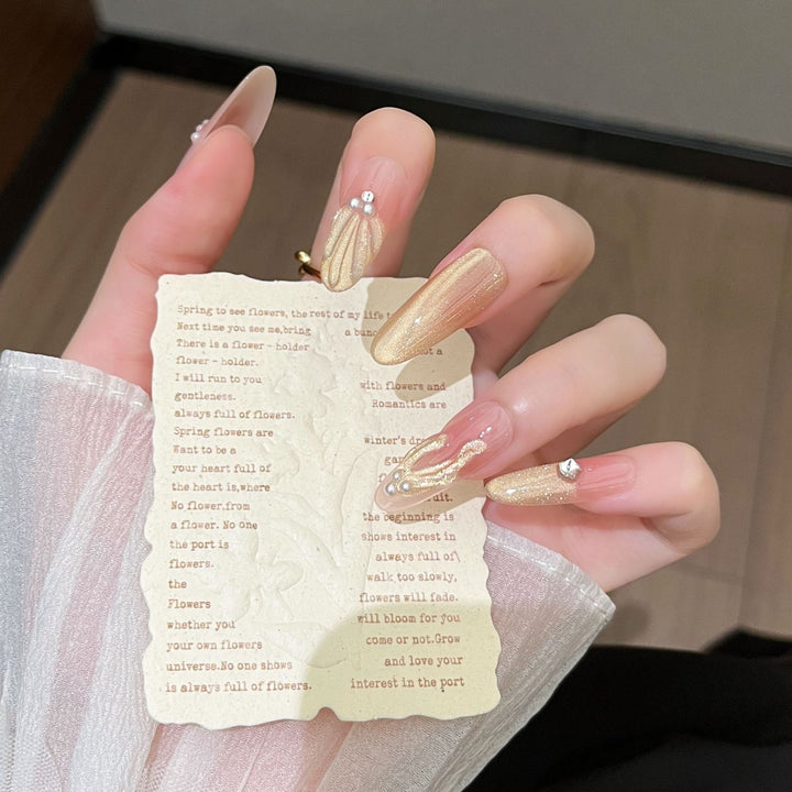 Artistic Stiletto Press-On Nail Art with Glimmering Accents Stornfield
