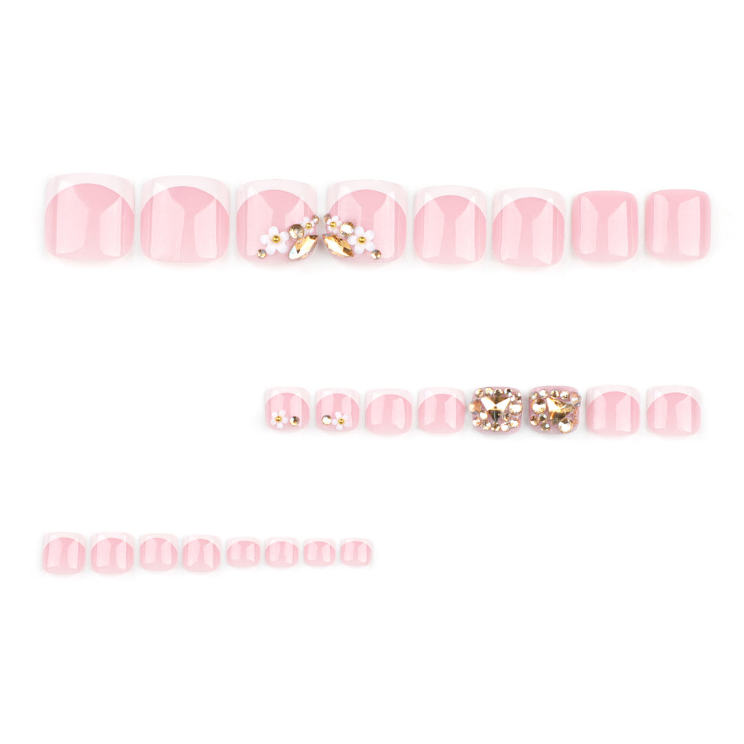 Artistic toenail art with elegant flower and glitter accents Stornfield
