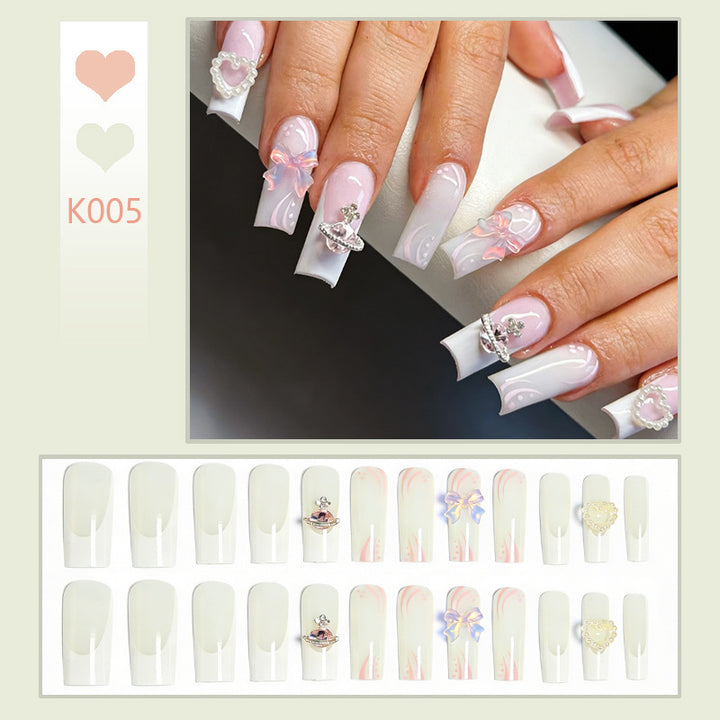 Artificial nails with delicate embellishments Stornfield