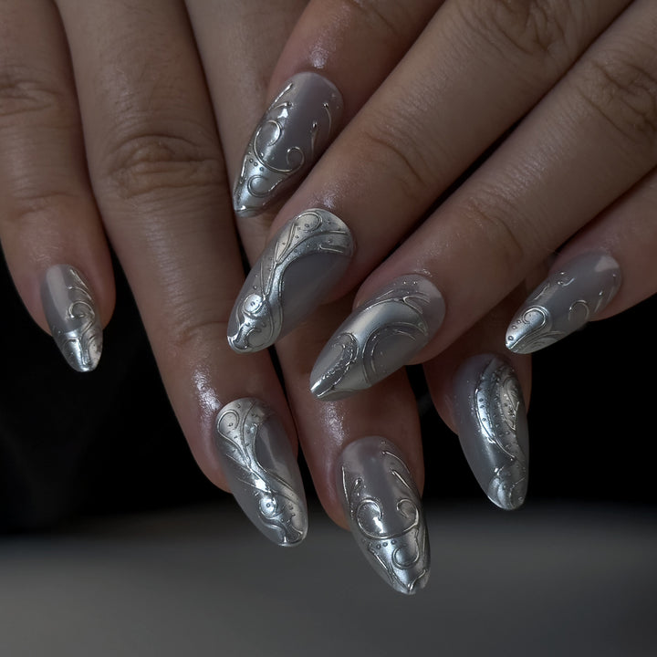 Artistic stiletto nails with elegant silver design Stornfield