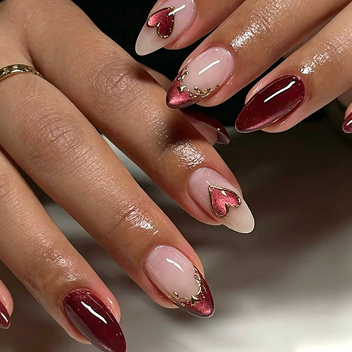 Artful stiletto nails with heart designs and glitter embellishment Stornfield