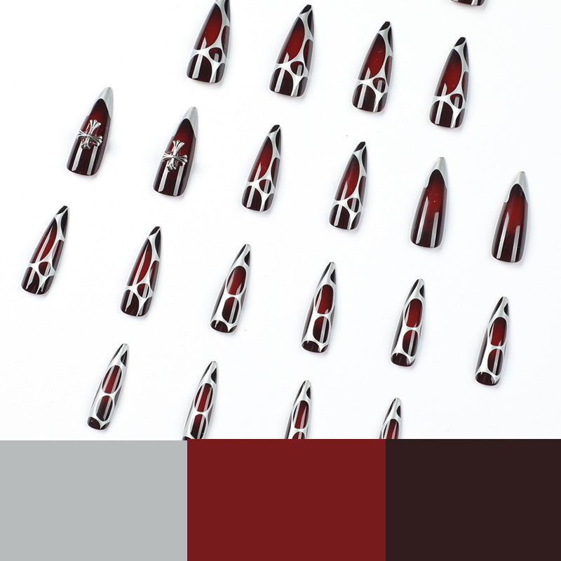 Artful Stiletto Nails with Elegant Cross Decoration Stornfield