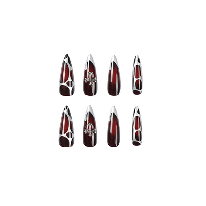Artful Stiletto Nails with Elegant Cross Decoration Stornfield