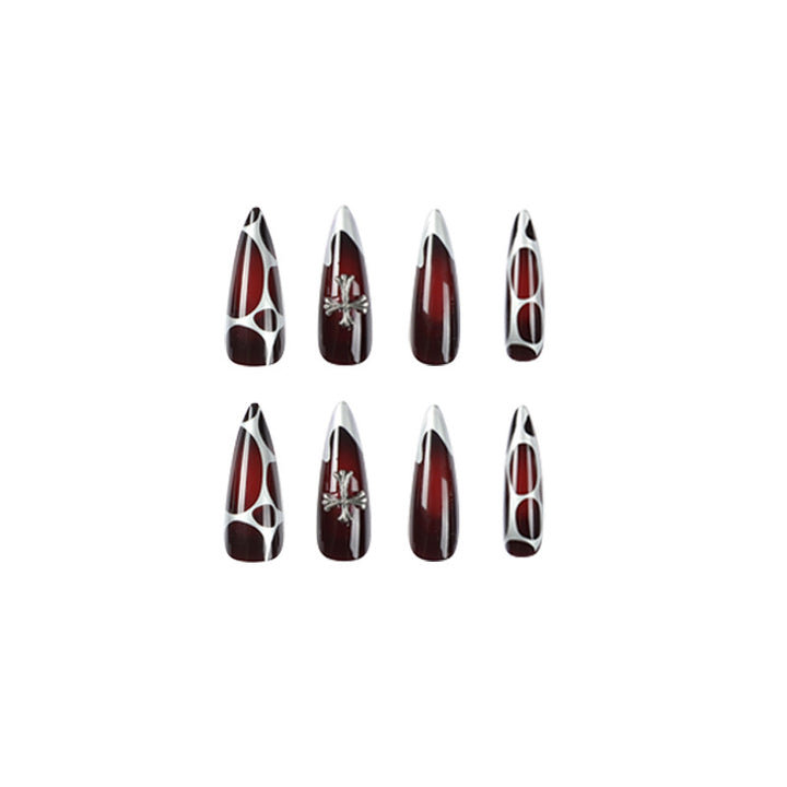 Artful Stiletto Nails with Elegant Cross Decoration Stornfield