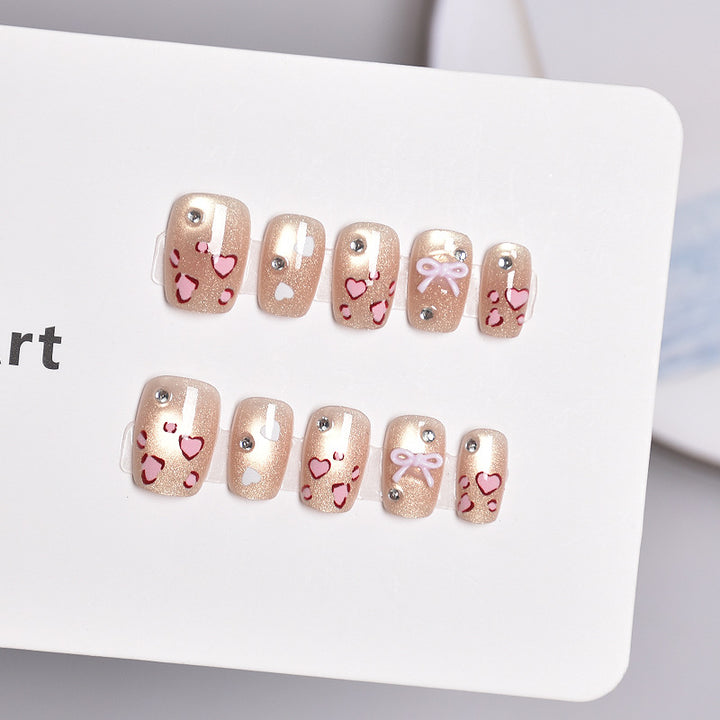 Artistic Press-On Nail Set with Heart and Bow Designs Stornfield