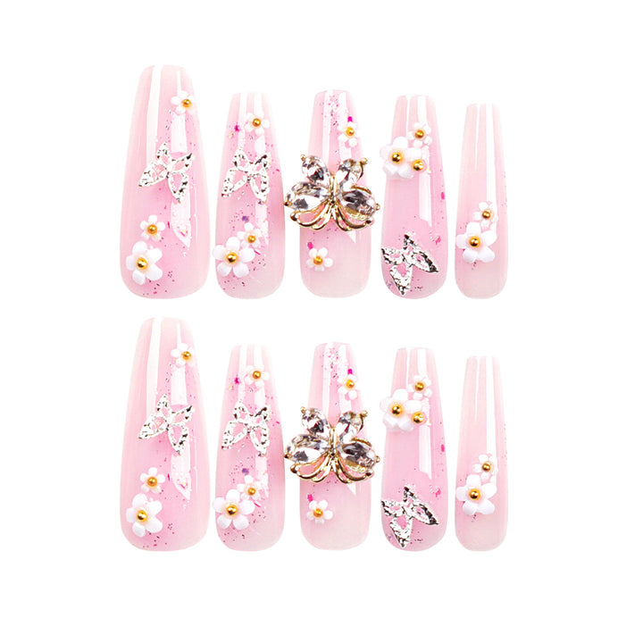Artistic Nail Extensions with Glitter and Floral Accents Stornfield