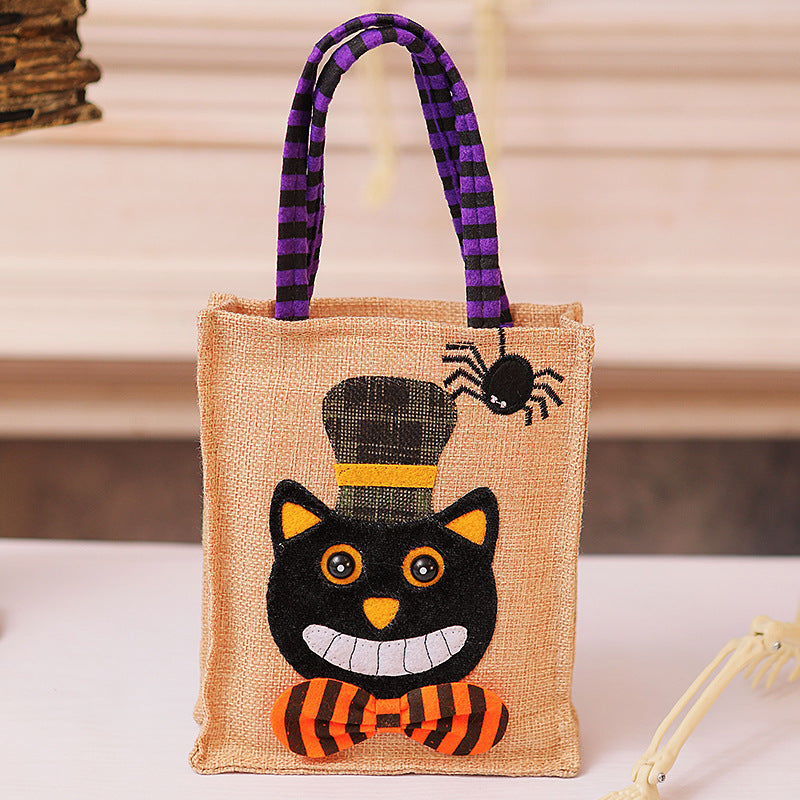 Halloween-Jute bag with stitched black cat and striped carrying handles
