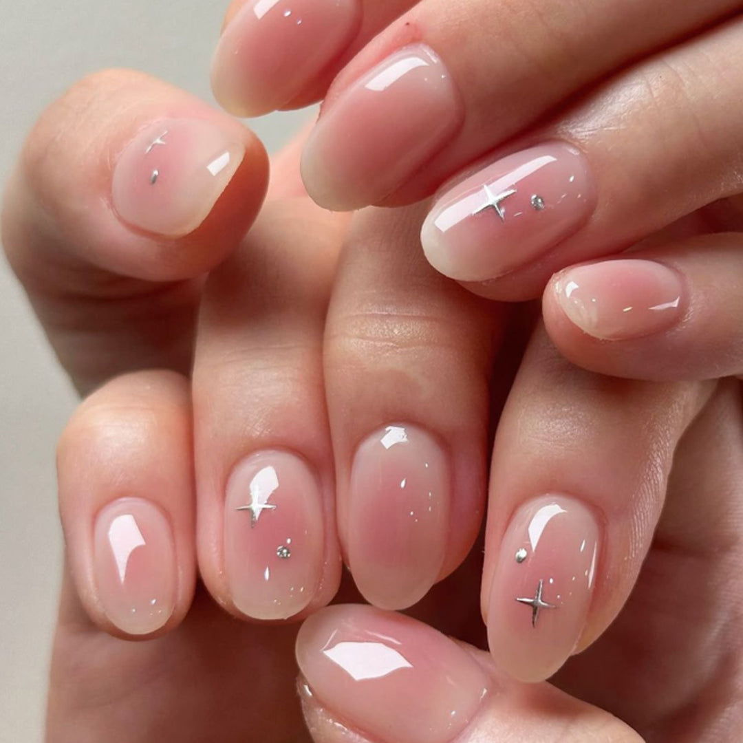 Artful nail extensions with shiny rhinestone accents Stornfield