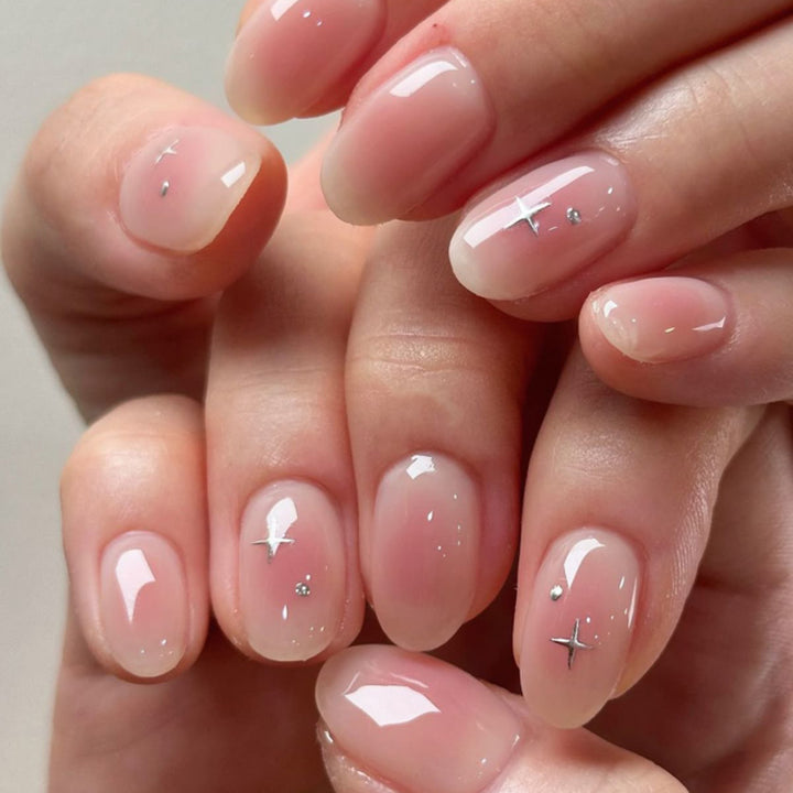 Artful nail extensions with shiny rhinestone accents Stornfield