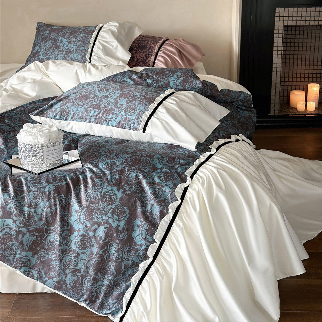 Reversible luxury bedding set made of cotton satin with gathered ruffle, floral jacquard inner side and contrasting velvet piping