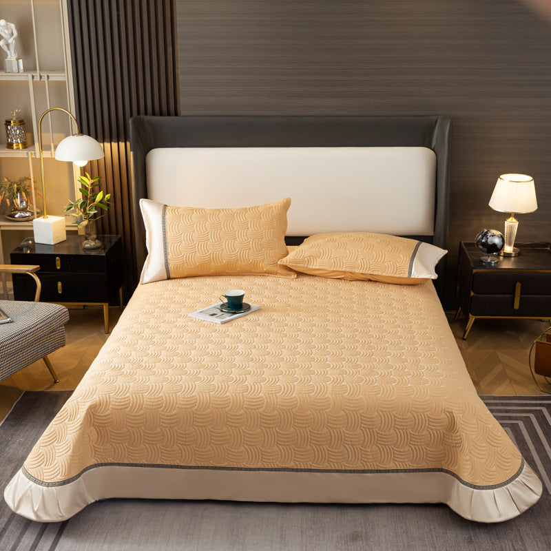 Quilted bedspread set with satin ruffle and geometric wave relief