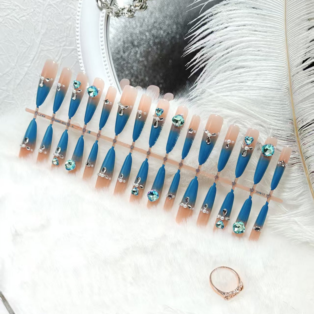 Glamorous artificial nails with sparkling rhinestone elements Stornfield