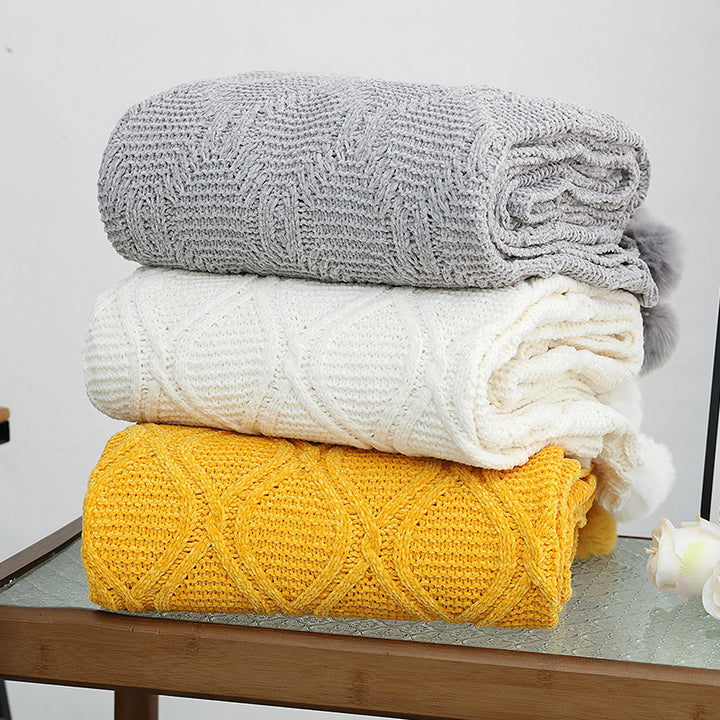 Ladies knit blanket with decorative pom poms Stornfield