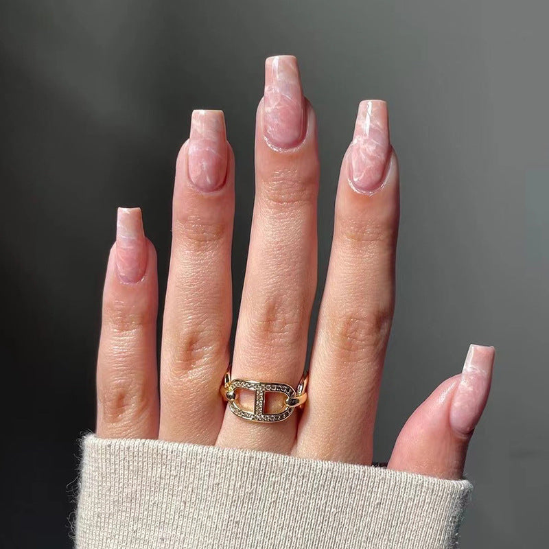 Elegant Nail Extensions with Marbled Accents Stornfield