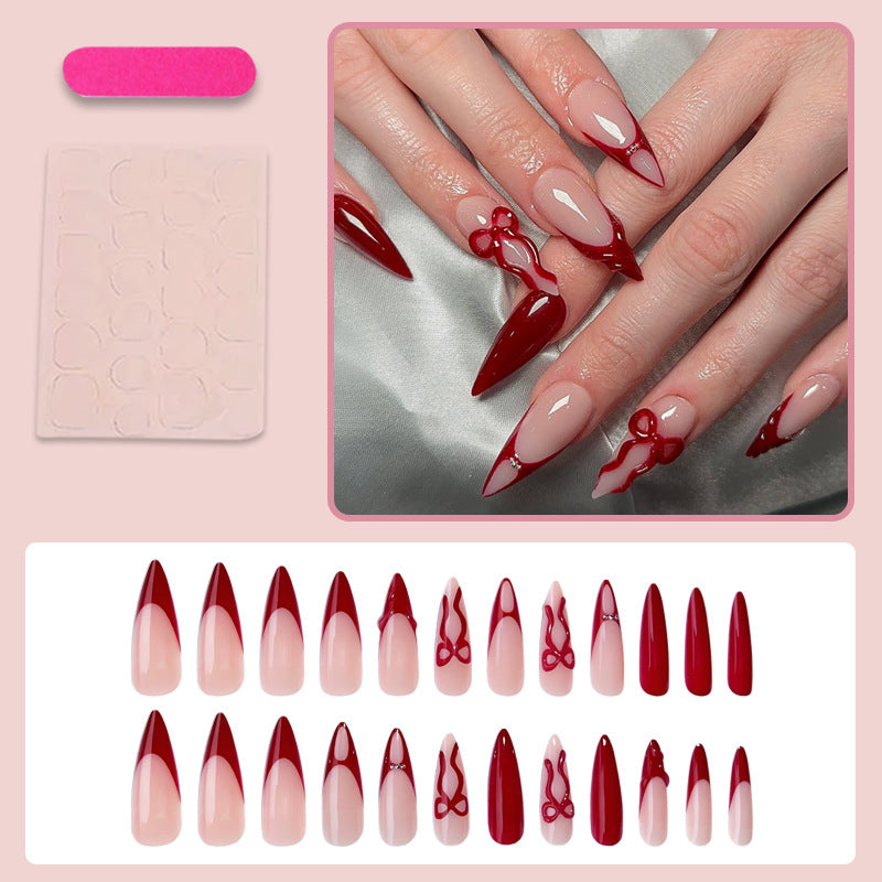 Artificial nails with elegant pointed designs and creative embellishments Stornfield