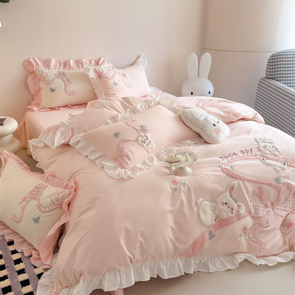 Romantic cotton satin bedding set with ruffles, plush appliqués and fine embroidery