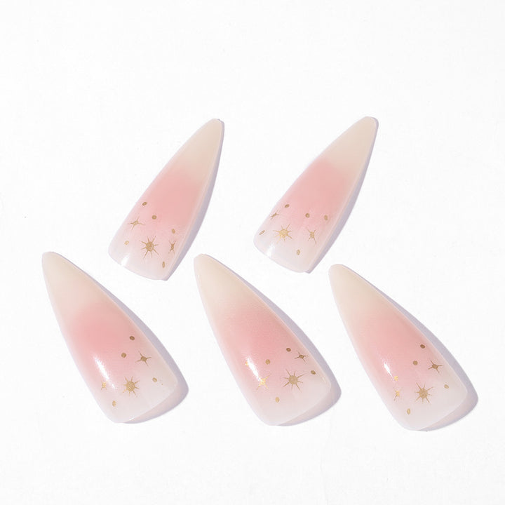 Acrylic nail set with delicate ombre design and glamorous star accents Stornfield