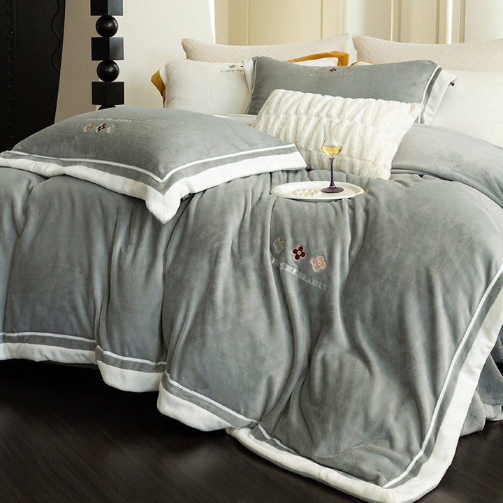 Velvety duvet cover set with embroidered floral design and contrasting piping