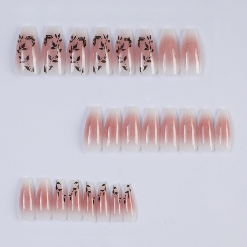 Artificial nails with elegant ombre design and floral accents Stornfield
