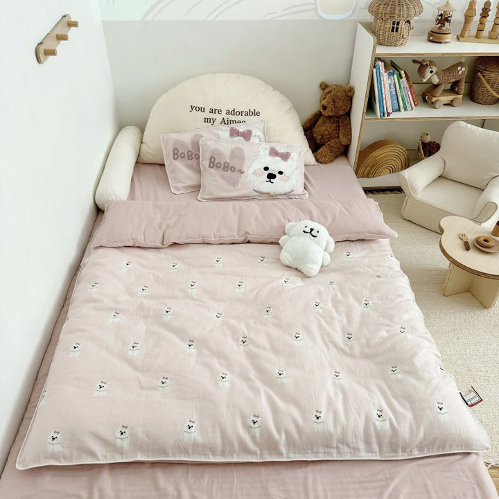Children's bedding set in futon style with embroidered puppy motifs and cuddle pillow