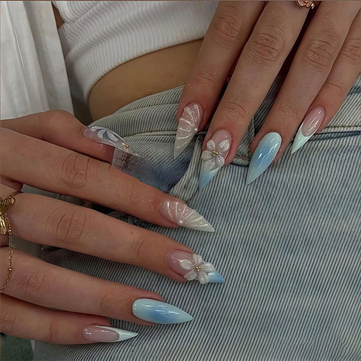 Stiletto nails with floral design and glitter accents Stornfield
