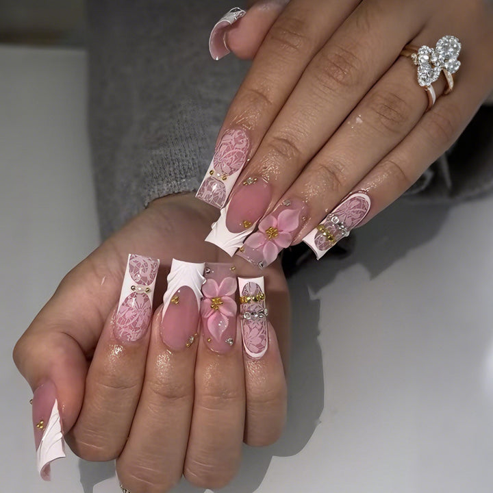 Artificial nail set with floral designs and sparkling accents Stornfield