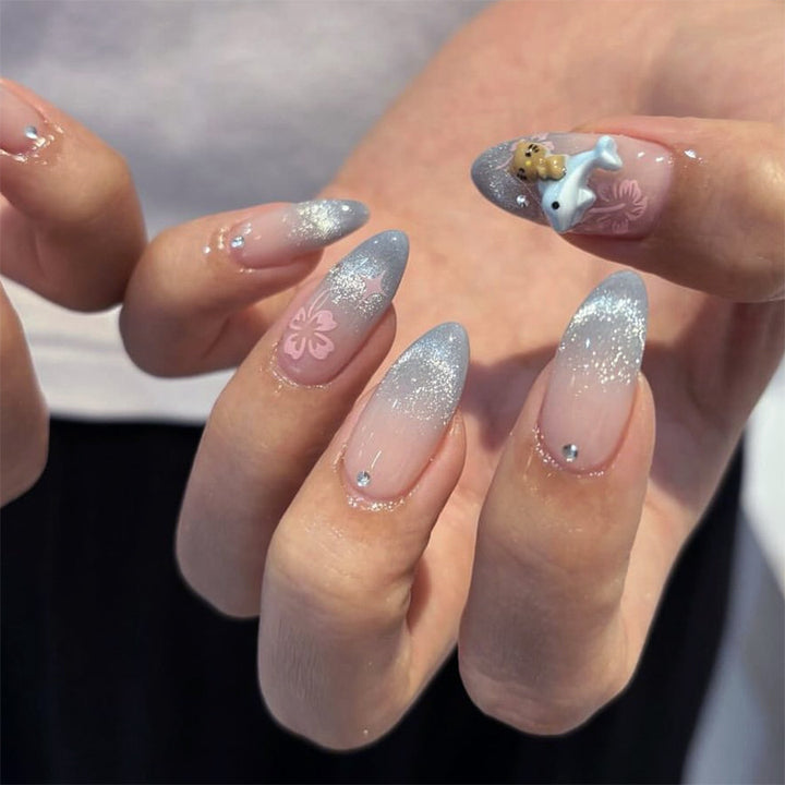 Artful nail extensions with elegant ombré design and floral accents Stornfield