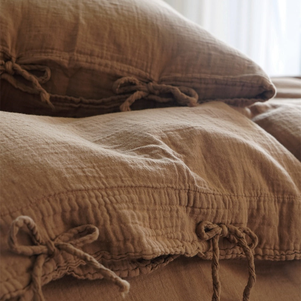 Natural linen bedding set with decorative ties and stonewashed texture