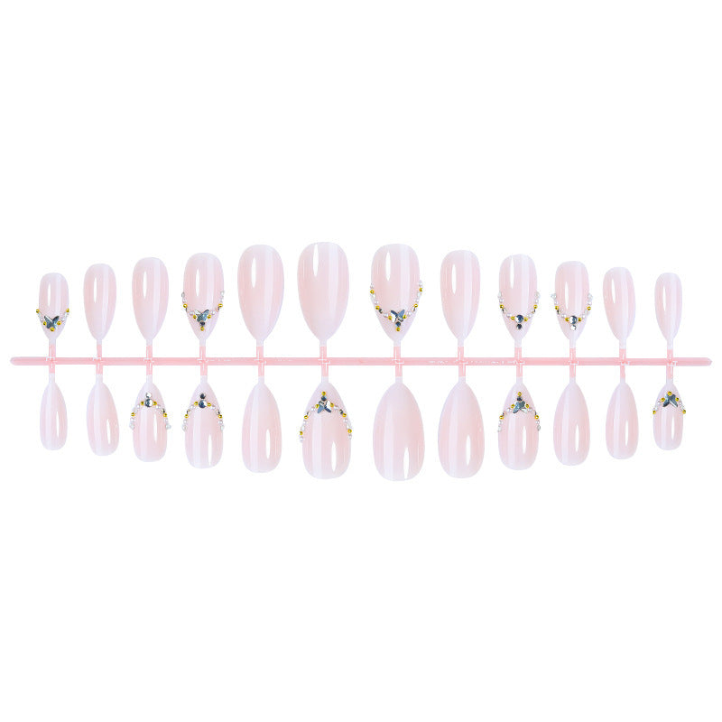 Acrylic nail set with elegant rhinestone decorations and glamorous designs Stornfield