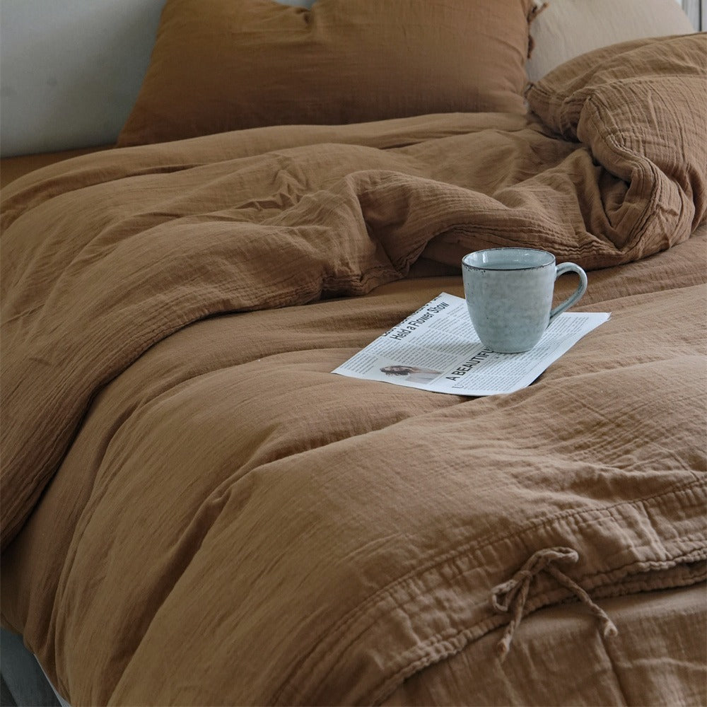 Natural linen bedding set with decorative ties and stonewashed texture