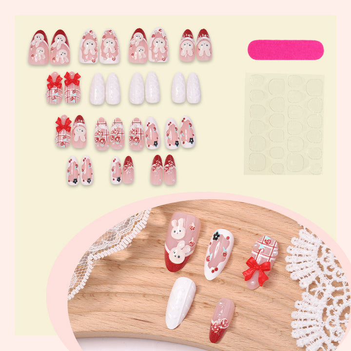 Creative acrylic nail set with playful bunny and gift designs Stornfield