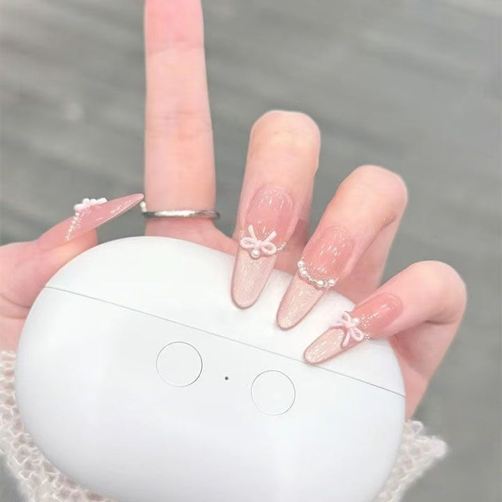 Elegant Stiletto Nail Art Tips with Pearl Accents