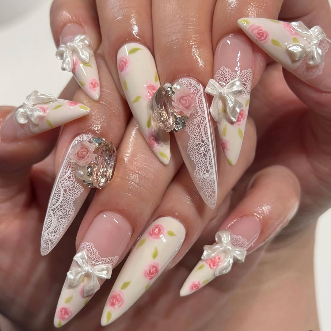 Artful stiletto nails with floral accents and glitter accents Stornfield
