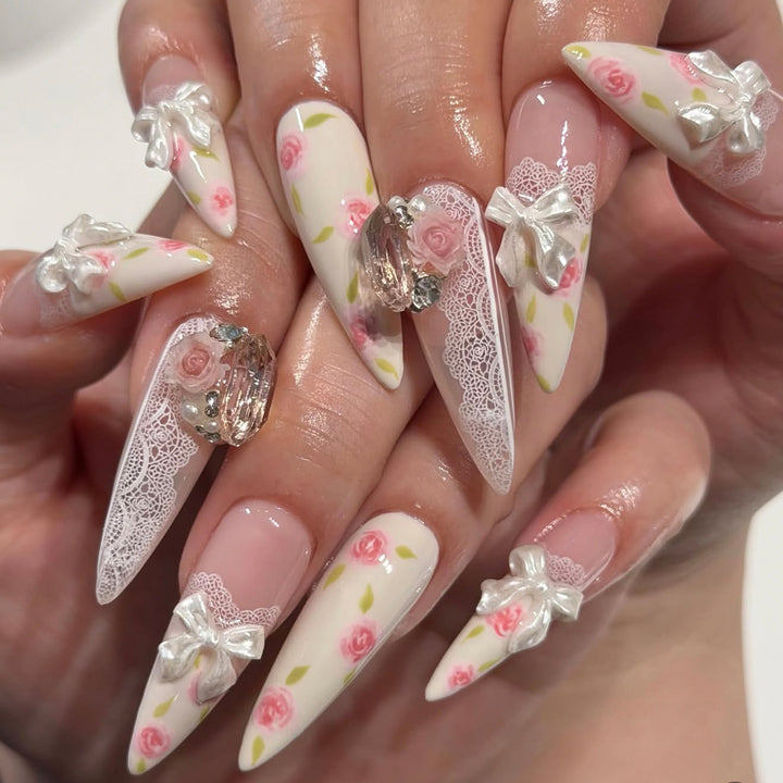 Artful stiletto nails with floral accents and glitter accents Stornfield