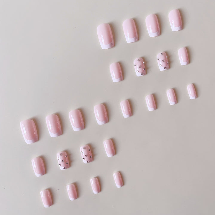 Artificial nail set with elegant rhinestones and French tip decorations Stornfield
