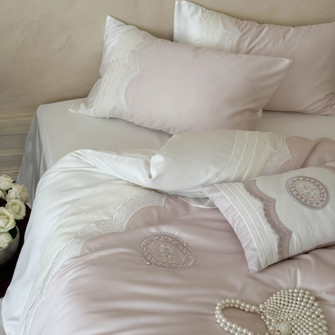 High-quality bedding set made of cotton satin with fine lace trim and embroidered medallion decorative cushions