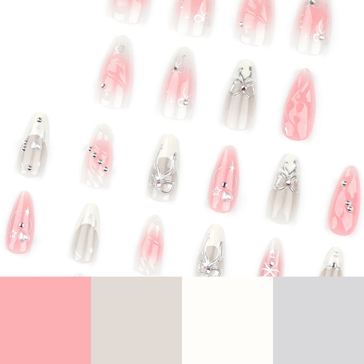 Artistic Nail Tips with Glitter and Bow Motifs Stornfield