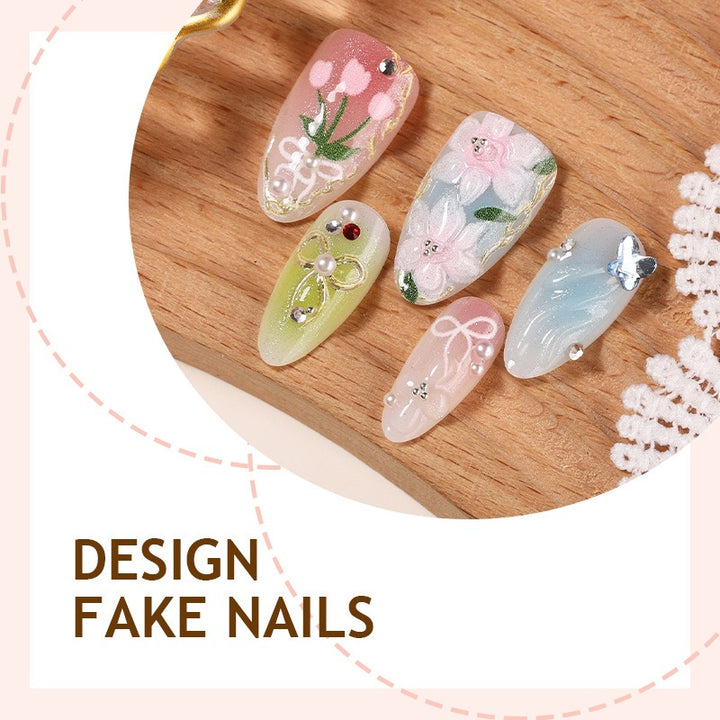 Artificial nail set with floral motifs and glitter accents Stornfield