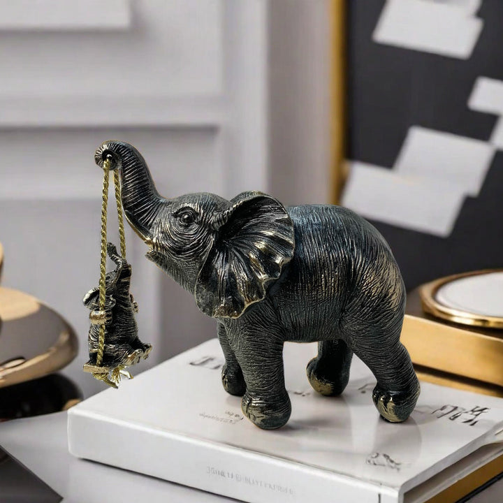Decorative elephant figure with child Stornfield