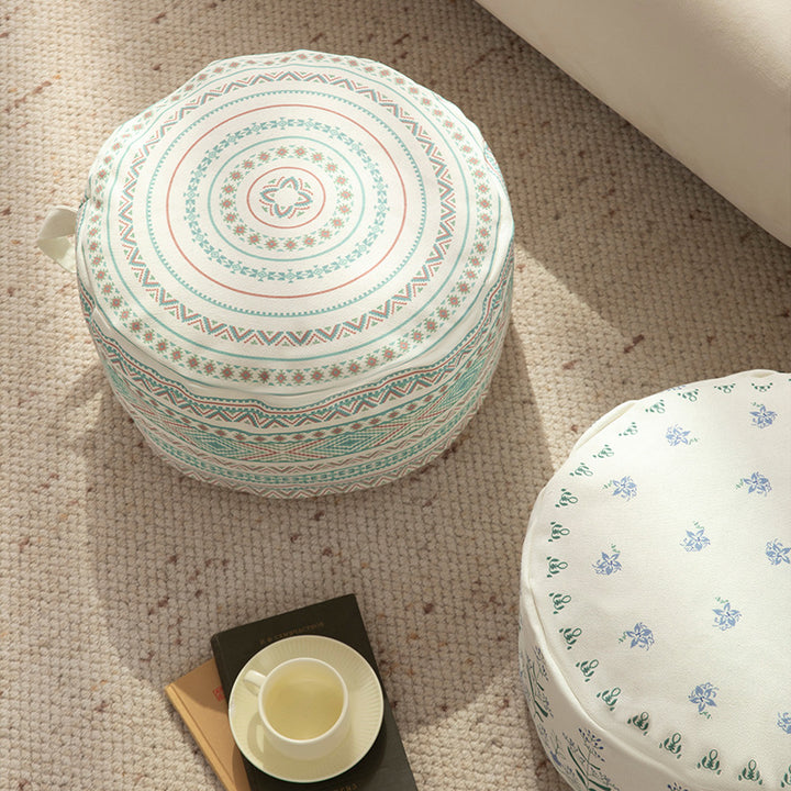 Round floor pouf with ethnic weaving pattern and practical carrying handle Stornfield