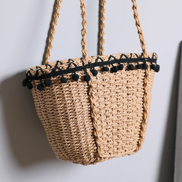 Delicate beach bag with pompons Stornfield