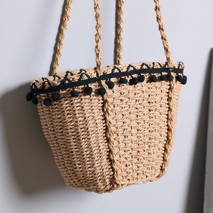 Delicate beach bag with pompons Stornfield