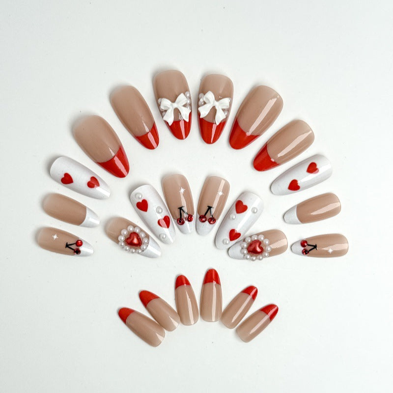 Creative nail art with heart and cherry motifs Stornfield