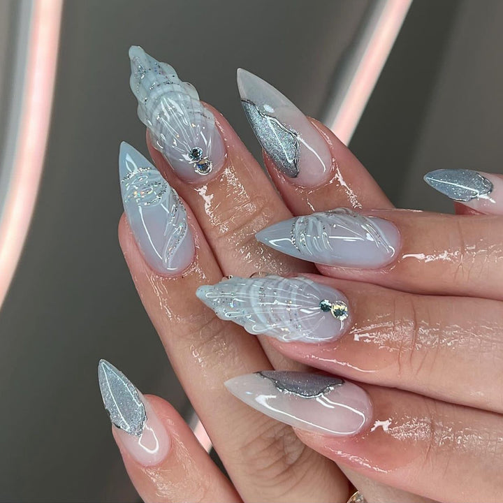 Artful stiletto nails with elegant glitter and floral design Stornfield