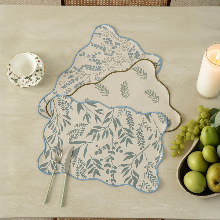 Shaped table set with curved contour and botanical leaf pattern Stornfield